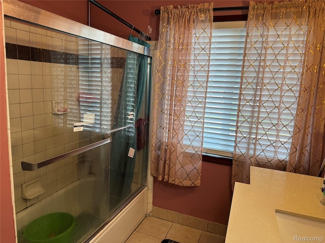 30347 Dell Ln, Warren, MI 48092 - full bathroom featuring tile patterned floors, healthy amount of natural light, combined bath / shower with glass door, and vanity