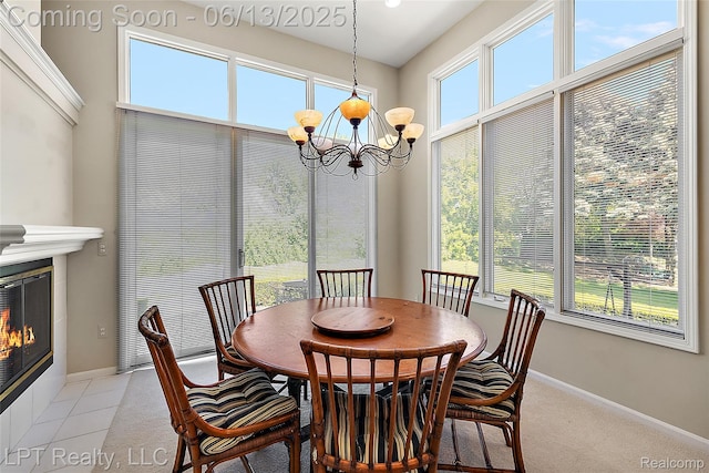 13815 Silent Woods Dr, Shelby Twp, MI 48315 - dining area with a chandelier, baseboards, and a fireplace with flush hearth