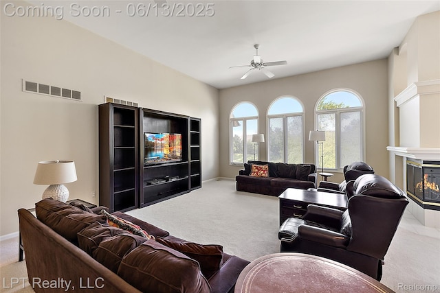 13815 Silent Woods Dr, Shelby Twp, MI 48315 - carpeted living area featuring ceiling fan, a multi sided fireplace, and baseboards