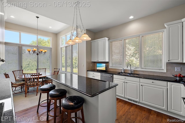 13815 Silent Woods Dr, Shelby Twp, MI 48315 - kitchen featuring a sink, tasteful backsplash, dark wood-style flooring, a chandelier, and recessed lighting