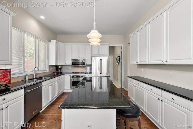 13815 Silent Woods Dr, Shelby Twp, MI 48315 - kitchen featuring appliances with stainless steel finishes, a sink, backsplash, dark wood finished floors, and recessed lighting