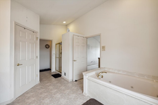 6819 Lakeway St, Ypsilanti, MI 48197 - full bathroom with a whirlpool tub, a stall shower, and tile patterned flooring