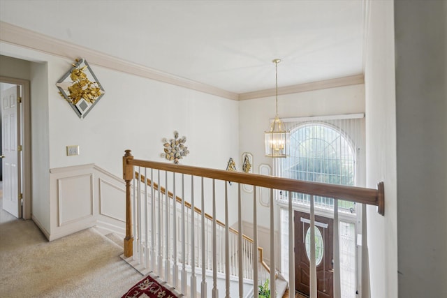 6819 Lakeway St, Ypsilanti, MI 48197 - entrance foyer featuring a chandelier, light colored carpet, plenty of natural light, and crown molding