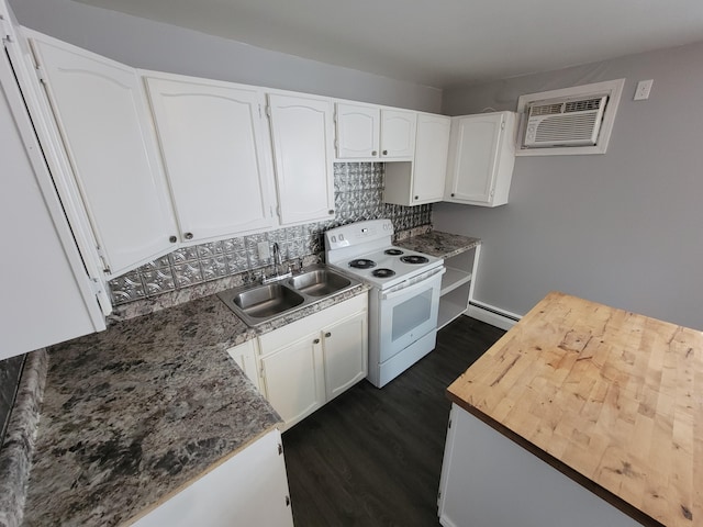 214 Arthur St, Manistee, MI 49660 - kitchen featuring white electric stove, a baseboard heating unit, a sink, a wall mounted air conditioner, and dark wood-style floors