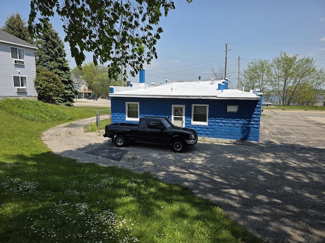214 Arthur St, Manistee, MI 49660 - view of side of home with a chimney