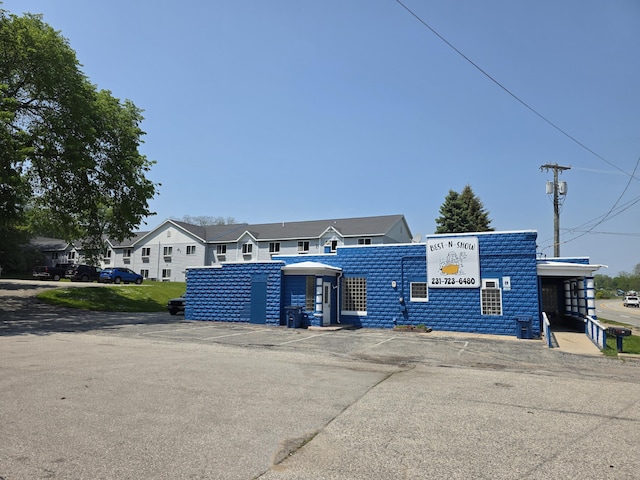 214 Arthur St, Manistee, MI 49660 - view of front of house with uncovered parking