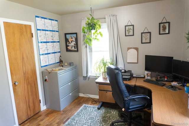 1247 Catalina Dr, Flint, MI 48507 - home office featuring wood finished floors and baseboards
