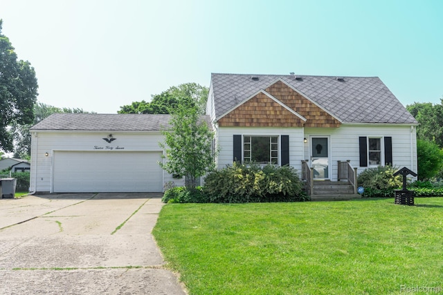 1247 Catalina Dr, Flint, MI 48507 - view of front of home with driveway, a front lawn, and an attached garage