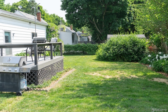 1247 Catalina Dr, Flint, MI 48507 - view of grassy yard featuring a deck