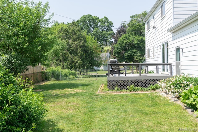 1247 Catalina Dr, Flint, MI 48507 - view of yard with a wooden deck