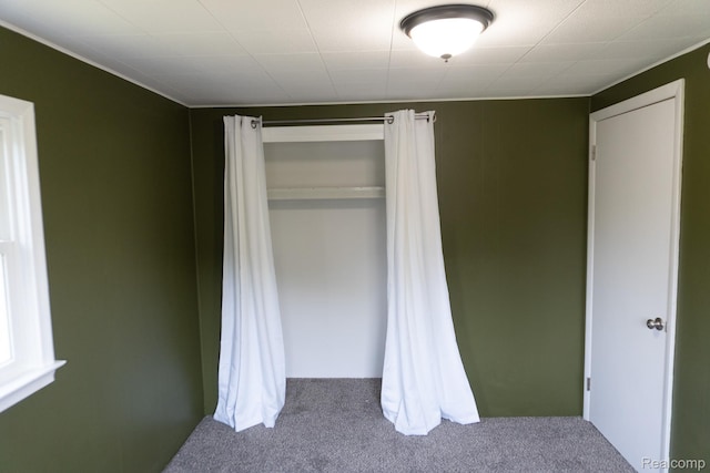 1247 Catalina Dr, Flint, MI 48507 - unfurnished bedroom with carpet floors and a closet