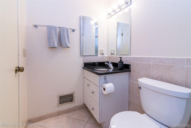 41350 Woodward Ave, Bloomfield Hills, MI 48304 - half bath with vanity, toilet, tile patterned floors, and tile walls
