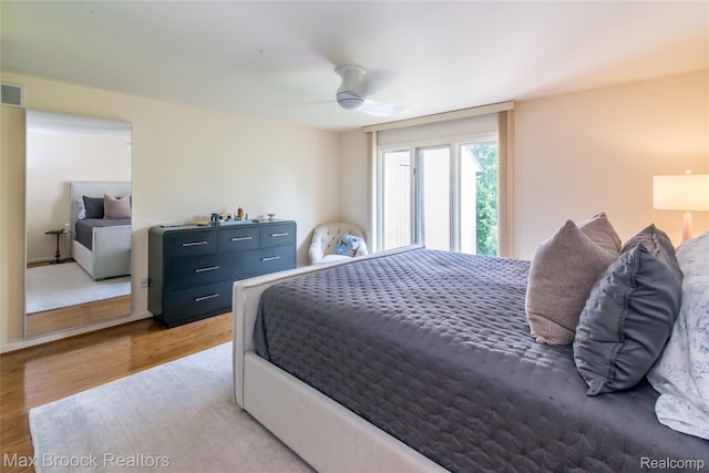 41350 Woodward Ave, Bloomfield Hills, MI 48304 - bedroom featuring wood finished floors and ceiling fan
