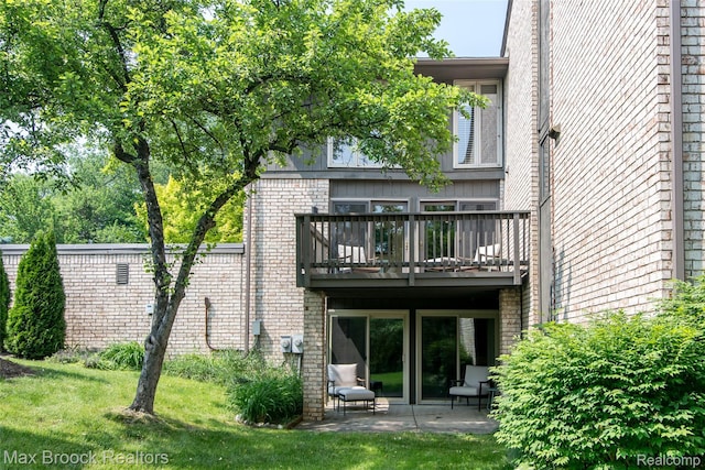 41350 Woodward Ave, Bloomfield Hills, MI 48304 - back of property with a balcony, a lawn, a patio, and brick siding
