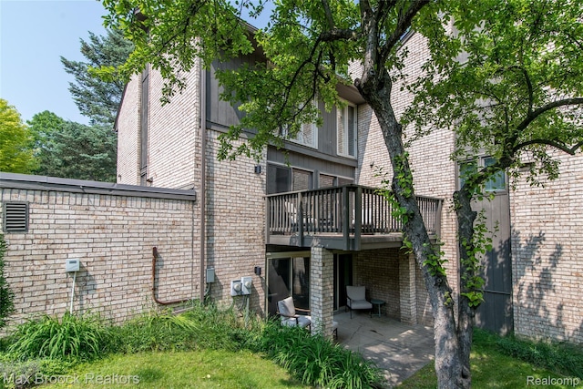 41350 Woodward Ave, Bloomfield Hills, MI 48304 - rear view of house with brick siding, a patio, and a deck