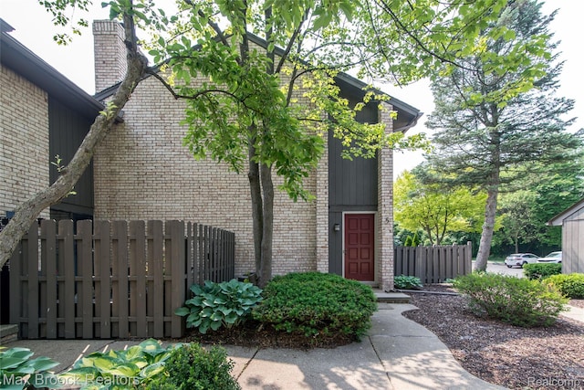 41350 Woodward Ave, Bloomfield Hills, MI 48304 - entrance to property with brick siding and a chimney