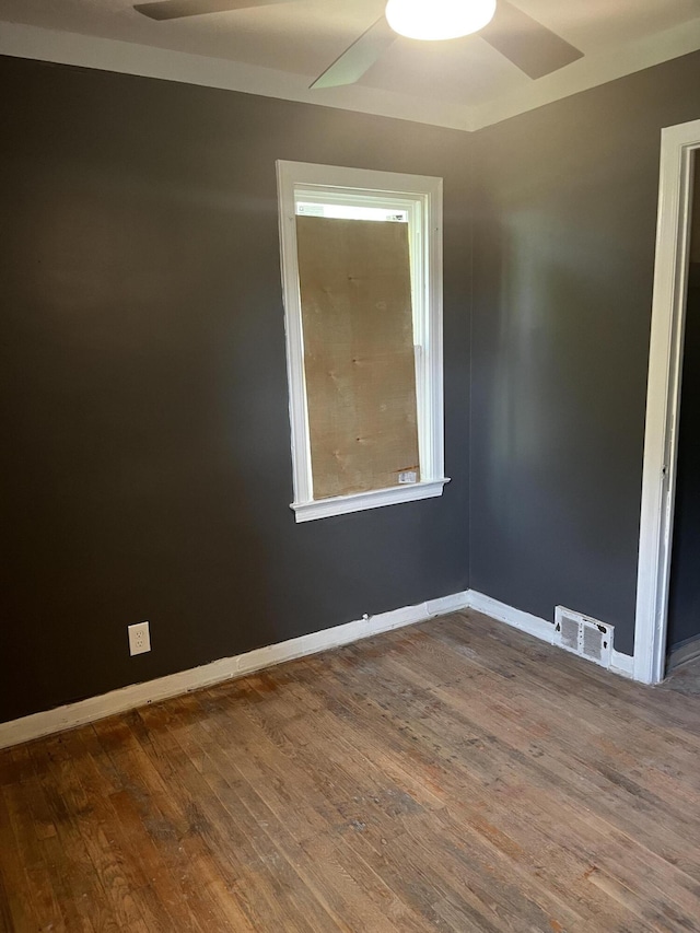 19188 Pelkey St, Detroit, MI 48205 - spare room featuring a ceiling fan, dark wood-style flooring, and baseboards