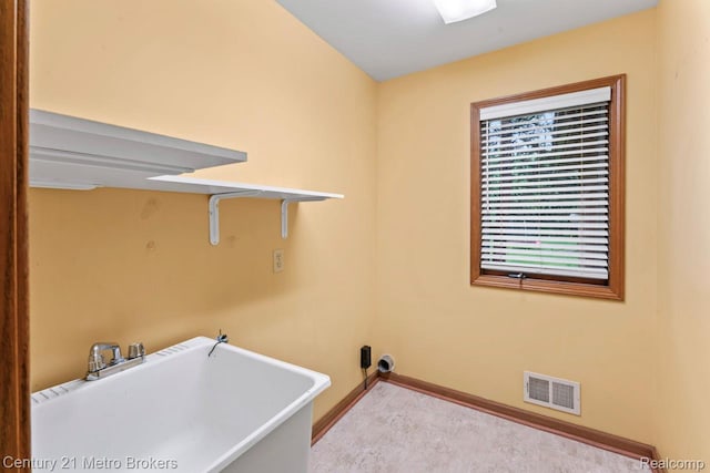 751 River Edge Ct, Flushing, MI 48433 - laundry room featuring baseboards and light colored carpet