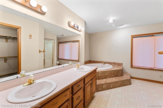 751 River Edge Ct, Flushing, MI 48433 - full bath with a bath, a stall shower, double vanity, and a spacious closet