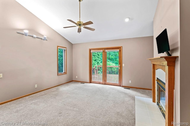 751 River Edge Ct, Flushing, MI 48433 - unfurnished living room featuring vaulted ceiling, carpet, a ceiling fan, and a tiled fireplace