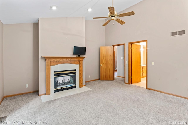 751 River Edge Ct, Flushing, MI 48433 - unfurnished living room with carpet floors, a tiled fireplace, high vaulted ceiling, and ceiling fan