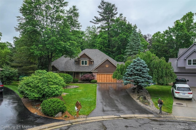 751 River Edge Ct, Flushing, MI 48433 - view of front facade featuring asphalt driveway, a front lawn, and a garage