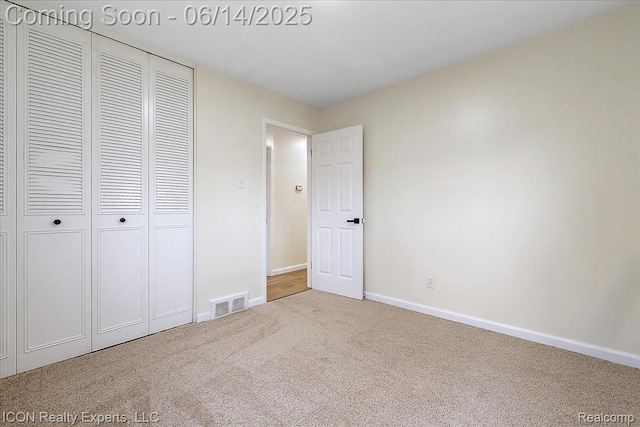 2570 Tarry Dr, Macomb, MI 48310 - unfurnished bedroom featuring carpet, baseboards, and a closet
