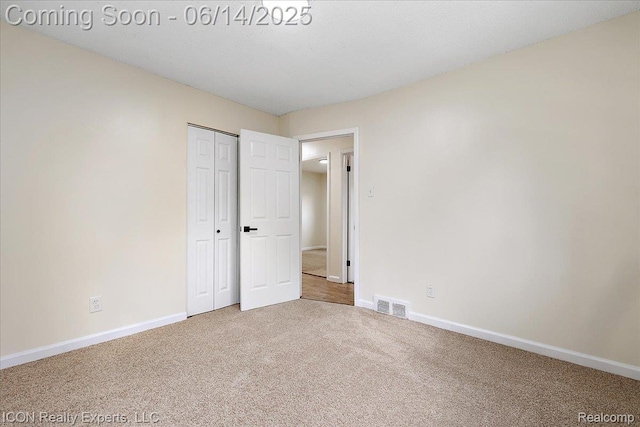 2570 Tarry Dr, Macomb, MI 48310 - unfurnished bedroom featuring carpet floors, baseboards, and a closet