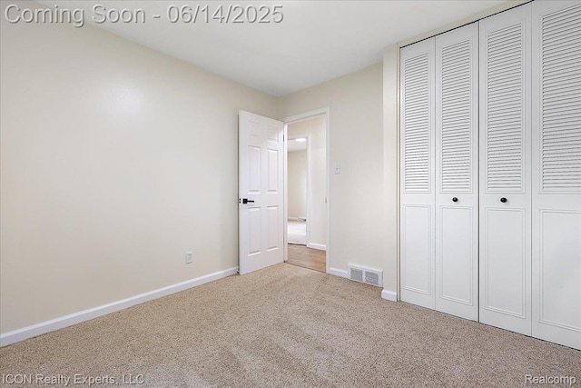 2570 Tarry Dr, Macomb, MI 48310 - unfurnished bedroom featuring carpet, baseboards, and a closet