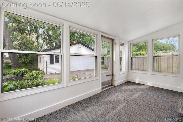 2570 Tarry Dr, Macomb, MI 48310 - unfurnished sunroom featuring lofted ceiling, baseboards, and carpet flooring