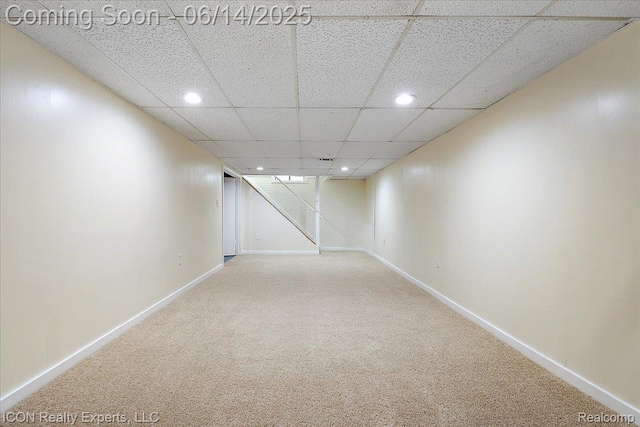 2570 Tarry Dr, Macomb, MI 48310 - finished below grade area with recessed lighting, carpet flooring, baseboards, and a paneled ceiling
