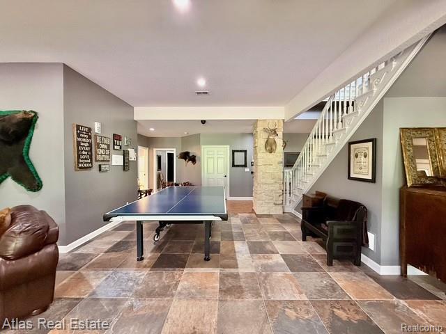5415 Walker Rd, Davison, MI 48423 - recreation room featuring baseboards, stone finish flooring, and recessed lighting
