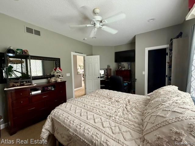 5415 Walker Rd, Davison, MI 48423 - carpeted bedroom with baseboards and ceiling fan