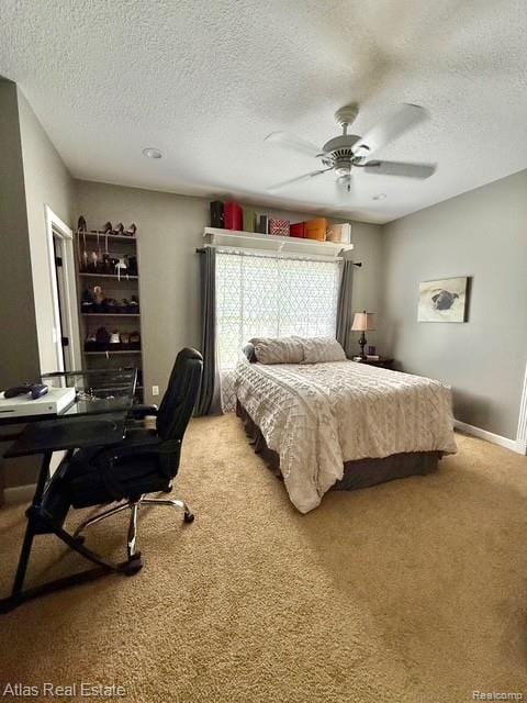 5415 Walker Rd, Davison, MI 48423 - carpeted bedroom featuring a textured ceiling, an office area, a ceiling fan, and baseboards