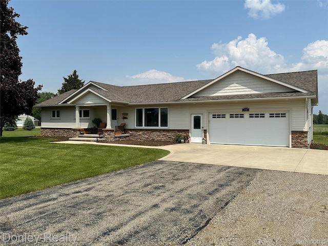 250 N Decker Rd, Snover, MI 48727 - ranch-style home featuring asphalt driveway, an attached garage, a shingled roof, a front yard, and stone siding