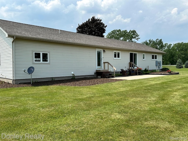 250 N Decker Rd, Snover, MI 48727 - back of house with a yard, a patio area, entry steps, and a shingled roof