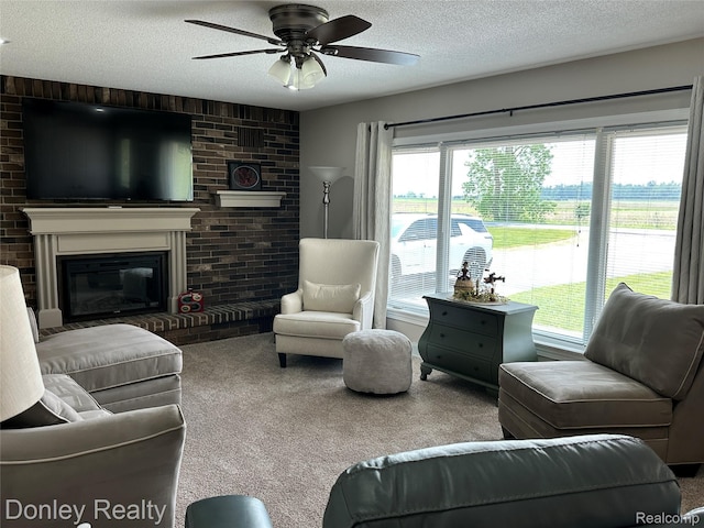 250 N Decker Rd, Snover, MI 48727 - living room with carpet, a textured ceiling, a brick fireplace, and ceiling fan