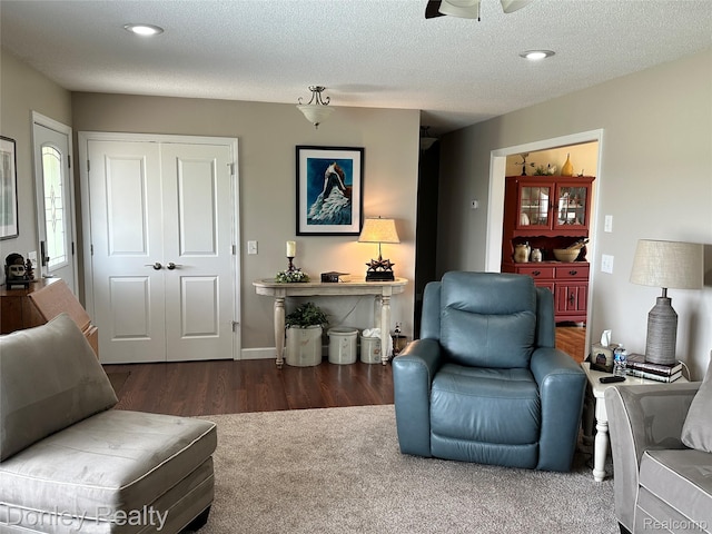 250 N Decker Rd, Snover, MI 48727 - living area with wood finished floors, a ceiling fan, recessed lighting, and a textured ceiling