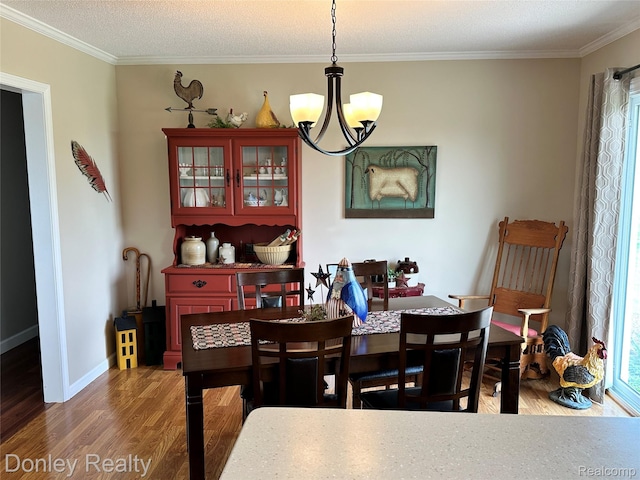 250 N Decker Rd, Snover, MI 48727 - dining room with a chandelier, crown molding, wood finished floors, and baseboards