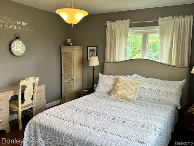 250 N Decker Rd, Snover, MI 48727 - bedroom featuring dark wood-style flooring, an office area, and baseboards