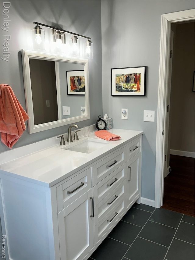 250 N Decker Rd, Snover, MI 48727 - bathroom featuring tile patterned flooring, vanity, and baseboards