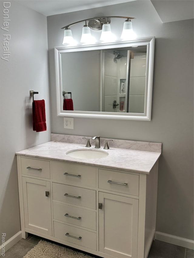 250 N Decker Rd, Snover, MI 48727 - bathroom with vanity, tile patterned flooring, and baseboards
