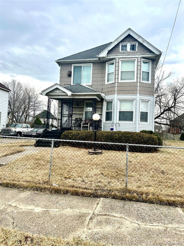 2541 Garland St, Detroit, MI 48214 - multi unit property featuring a fenced front yard, a porch, and roof with shingles