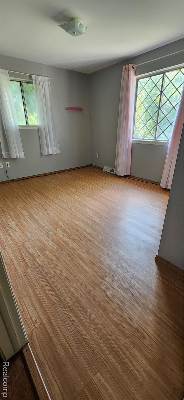 7040 Banks, Waterford, MI 48327 - unfurnished room with wood finished floors and baseboards