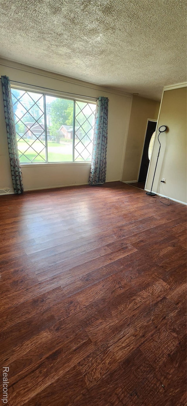 7040 Banks, Waterford, MI 48327 - spare room with a textured ceiling and wood finished floors