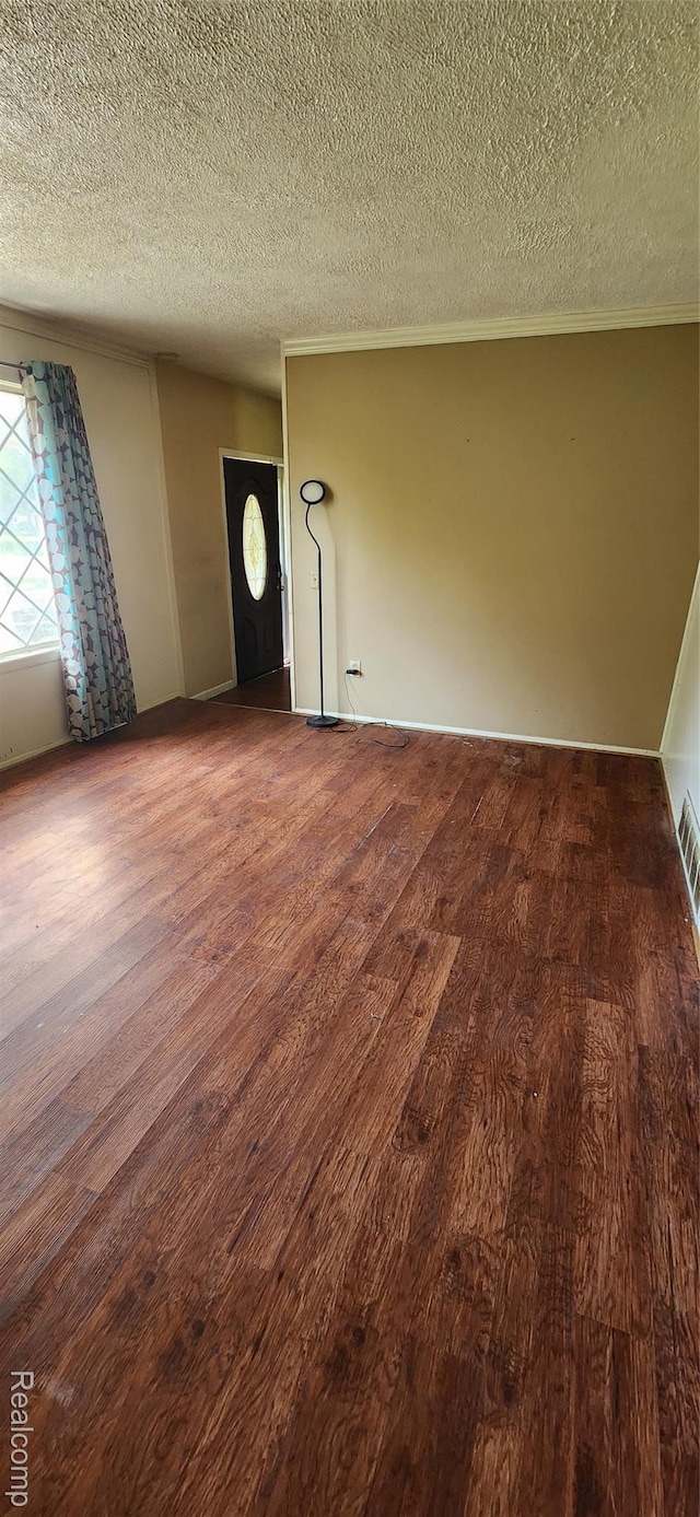 7040 Banks, Waterford, MI 48327 - unfurnished room with wood finished floors, a textured ceiling, and ornamental molding