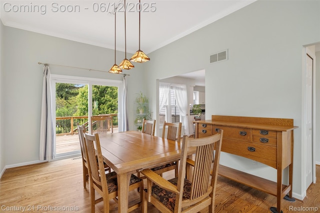11213 Youngstree Ct, Davisburg, MI 48350 - dining room with light wood-style floors, ornamental molding, and baseboards