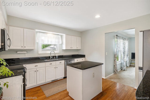 11213 Youngstree Ct, Davisburg, MI 48350 - kitchen featuring a sink, stainless steel appliances, white cabinetry, healthy amount of natural light, and recessed lighting
