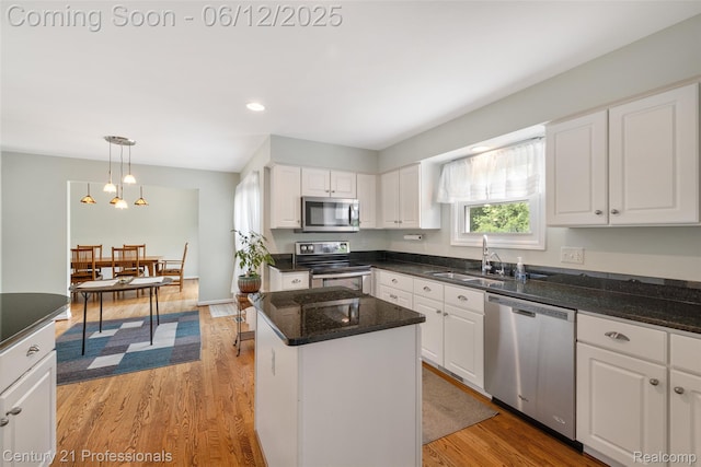 11213 Youngstree Ct, Davisburg, MI 48350 - kitchen with appliances with stainless steel finishes, a sink, white cabinetry, and recessed lighting