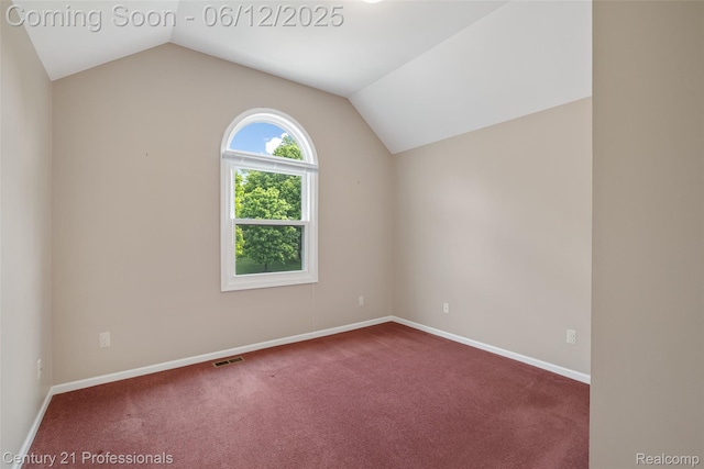 11213 Youngstree Ct, Davisburg, MI 48350 - carpeted empty room with vaulted ceiling and baseboards